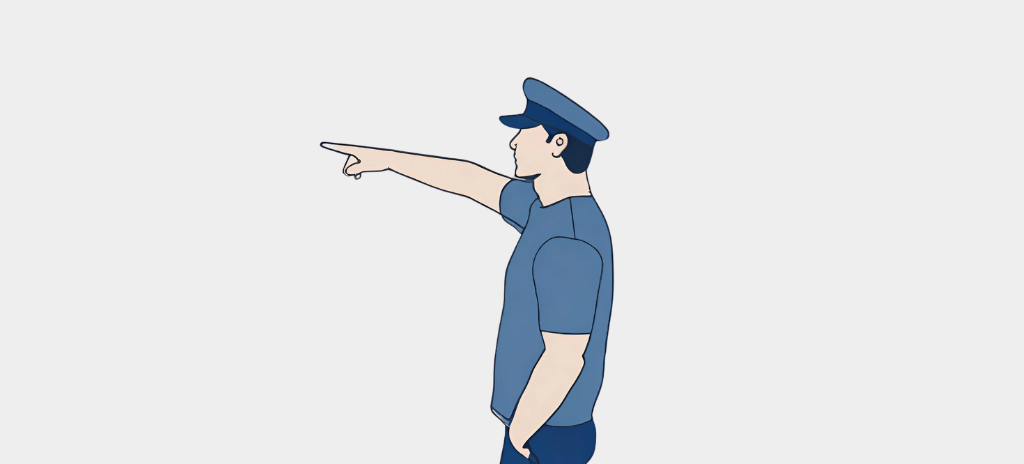 Person wearing peaked cap point